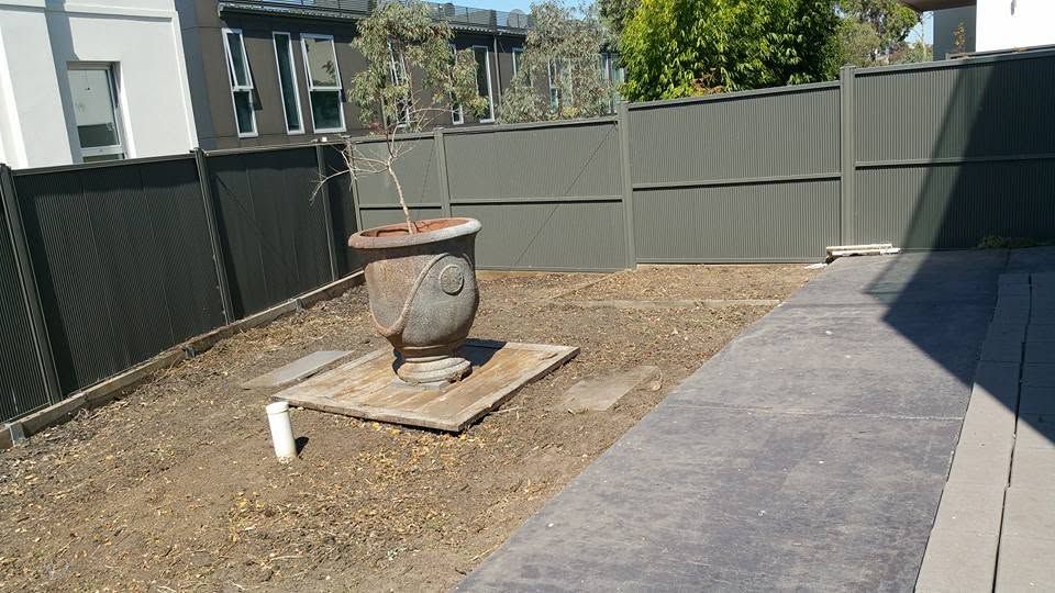 Backyard cleared with tidy paved paths